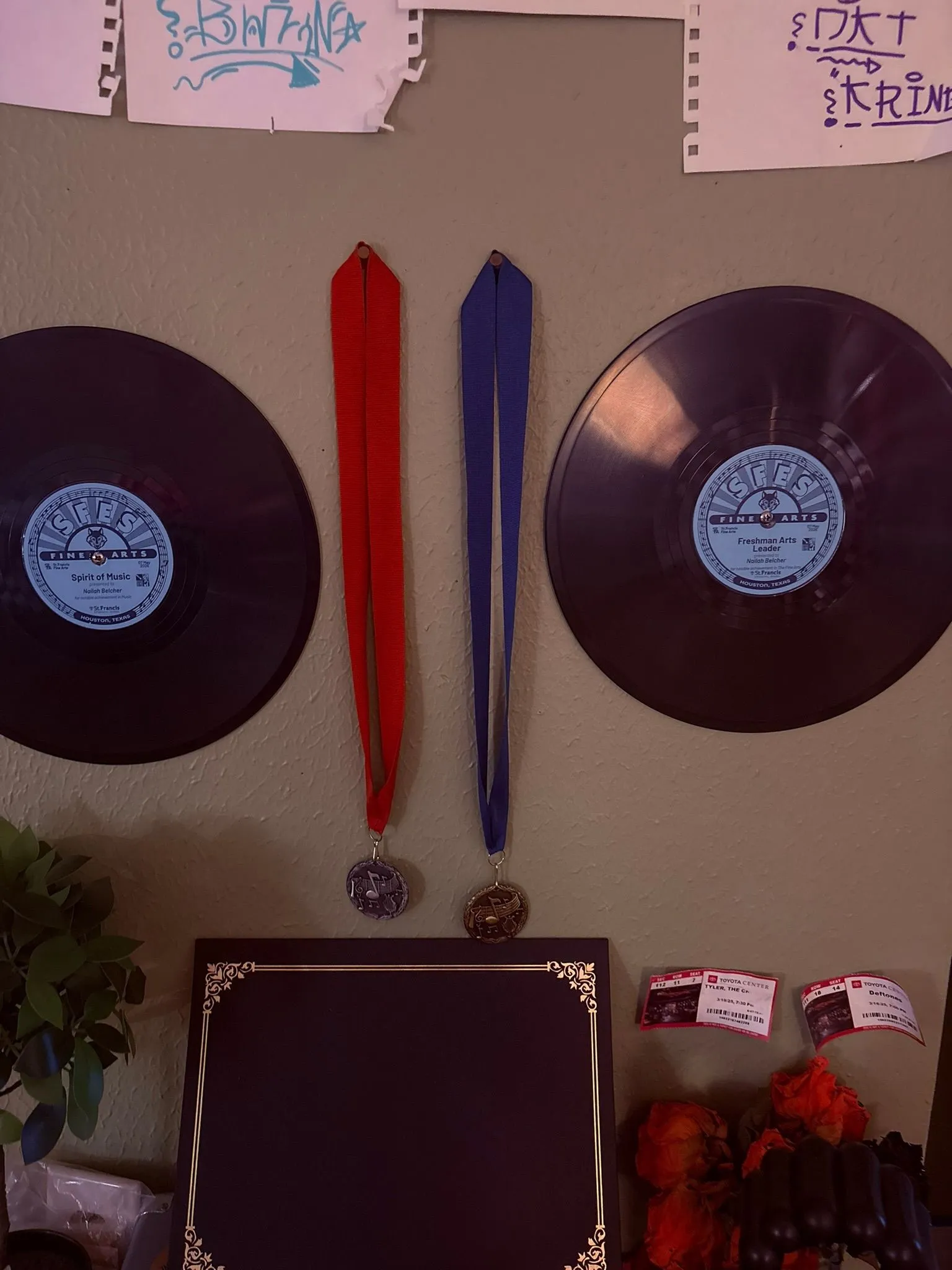 Nailah Belcher's display of Spirit of Music and Freshman Arts Leader records with medals and a plaque